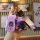 A hand holds a purple buick key cover with a matching bear-shaped charm and a stylish strap, designed for models like regal, ...