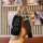 A hand holds a sleek black aion u5/u6 key cover with a full-body leather remote protector, featuring a stylish h charm and nu...