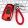 Red dongfeng tianlong kx key cover with braided leather keychain, featuring lock and unlock buttons, displayed on a keyboard ...