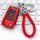 Red chevrolet key cover for cruze, malibu & trax, featuring a braided leather keychain and sleek design, displayed on a keybo...