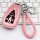Pink leather key cover for changan cs75 plus, featuring a braided strap and secure clip, displayed on a keyboard background.
