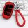 Red jeep key cover for cherokee, compass, and grand cherokee, featuring a braided leather keychain and sleek design, displaye...
