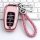 Pink h5 key cover for 2021 hongqi h5 ehs9, featuring a braided pink strap and sleek design, displayed on a keyboard backgroun...