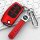 Red ford escape key cover with braided leather strap, featuring a sleek design and functional buttons, displayed on a keyboar...