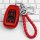 Red subaru forester 2021 key cover with braided red leather keychain, featuring a sleek design and functional buttons, displa...