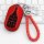 Red maserati key cover for levante & ghibli, featuring premium leather and a braided keychain, displayed on a sleek keyboard ...