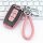 Elegant pink kia key cover for k3, k5, sportage, seltos, and forte, featuring a braided leather keychain and sleek design.