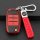 Red and black leather kia k3 smart key cover with braided strap and silver keychain, showcasing sleek design and functionalit...