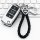 Elegant vw key cover for lavida, tiguan l, golf 7, featuring a sleek design with a braided leather keychain and a metallic fi...