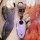 A hand holds a sleek, lavender lantu zhuiguang key cover 2023 free edition, featuring a metallic car logo and a stylish carab...