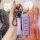 A hand holds a stylish purple wey car key cover for vv7, vv5, and tank 300 models, featuring a premium leather strap with wey...