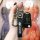 A hand holds a sleek hyundai elantra key cover, featuring a black leather strap with the hyundai logo and a matching key fob,...