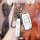 A hand holds a vvdi kd-compatible foldable key shell for toyota vios, featuring a sleek white design with metallic accents an...