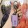 A hand holds a sleek, lavender changan suzuki sx4 key cover with a metallic finish and a carabiner clip, set against a vibran...