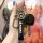 A hand holds a suzuki key cover set, featuring a sleek black design with the suzuki logo, compatible with models like vitara,...
