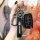 A hand holds a sleek black hyundai key cover with a carabiner and leather strap, designed for elantra, tucson, sonata, and mo...