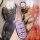 A hand holds a pink jeep key cover for compass, grand commander, and cherokee, featuring a sleek design with a silver carabin...