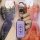 A hand holds a purple mitsubishi key cover for outlander, eclipse cross, and asx, featuring a sleek design with a silver cara...