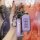 A hand holds a purple mitsubishi key cover for outlander, eclipse cross & asx, featuring a sleek design with a carabiner and ...