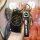A hand holds a sleek black chery key cover with a leather strap and carabiner, designed for models like the tiggo 3, tx, and ...