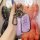 A hand holds a purple beiqi senbao x35 key cover, featuring a leather strap with senova branding and a sleek design for remot...