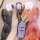 A hand holds a gac trumpchi gs4 key fob encased in a premium leather cover, featuring a sleek purple design with functional b...