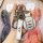 A hand holds a sleek mini cooper key cover for f54/f55/f56/f60, featuring a premium leather strap and a stylish metallic desi...